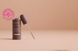 A brown skincare product bottle from bioelements with a New Beauty 2025 Award Winner stamp.