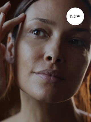 Close-up of a woman's face with a 'new' label in the corner.